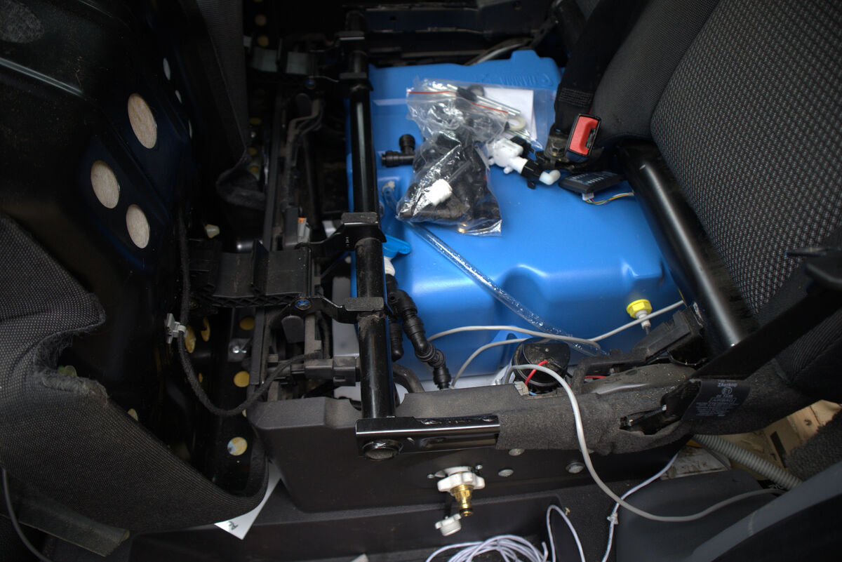Fresh water tank fitted under the front seats